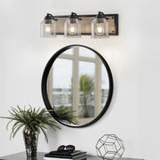 Multi-light wall sconce above a double vanity, providing balanced illumination for modern bathrooms.
