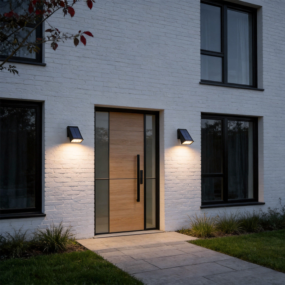 Down light wall sconce installed beside a modern front door entrance