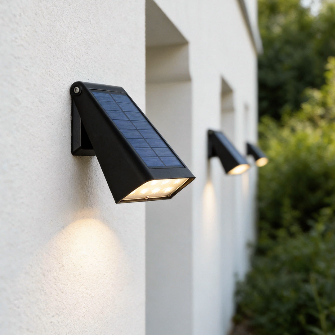 solar down light wall sconce on an exterior garden wall