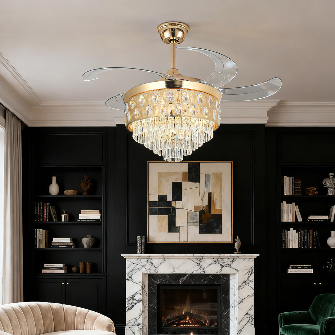 Dramatic ceiling fans with crystal lights over a black and white marble fireplace 