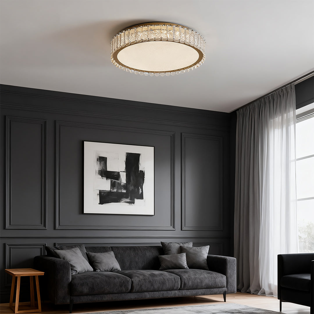 Dramatic flush mounted LED lights featuring glass shade chandelier influence installed in moody dark-toned living room space.