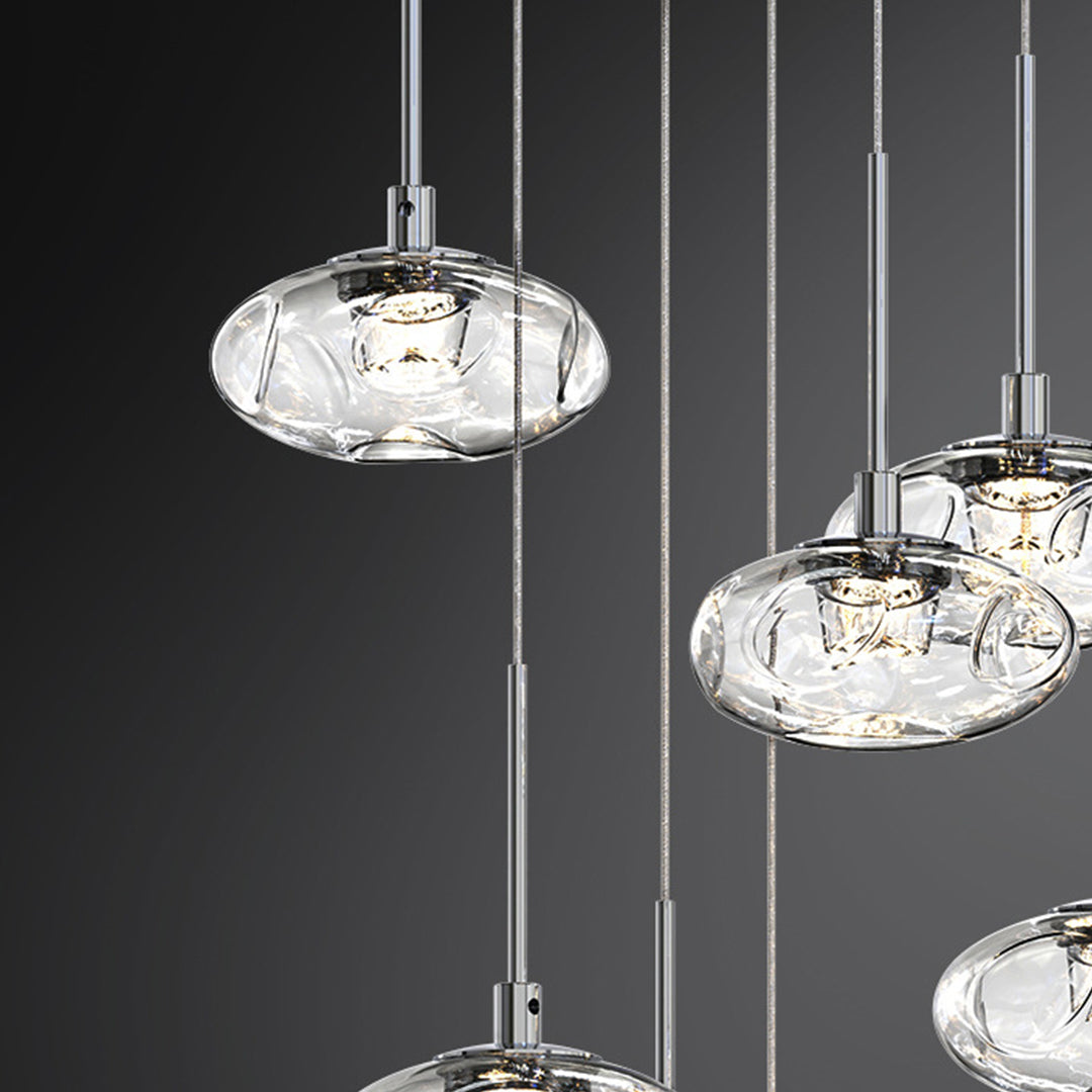 Stunning chandelier for tall ceilings creating dramatic focal point in contemporary stairwell with cascading glass design