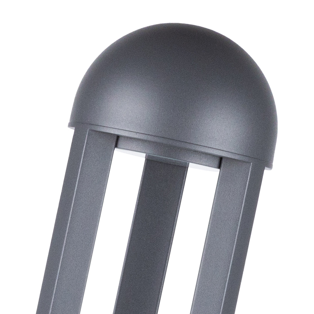 Modern bollard lights creating dramatic ground lighting effects on paved surface