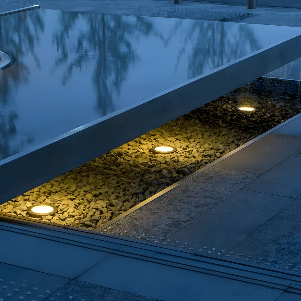 LED fountain lights creating dramatic underwater illumination in modern swimming pool design