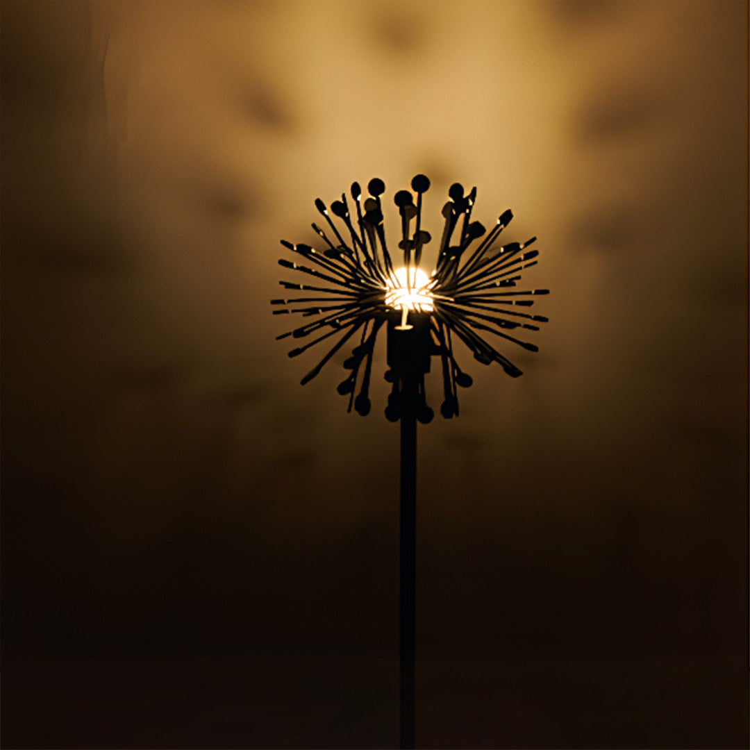 Dramatic warm lighting from sculptural starburst fixture creating stunning visual impact for landscape garden lights