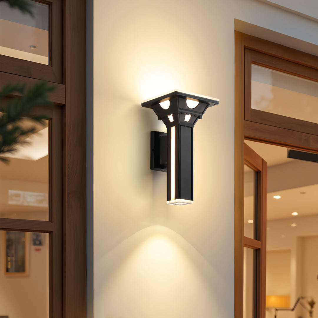 Outdoor wall column lights mounted on a textured exterior wall creating dramatic light spread.