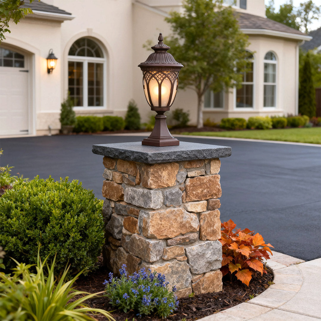 Garden pillar light in a driveway setting, stylish and warm outdoor lighting solution