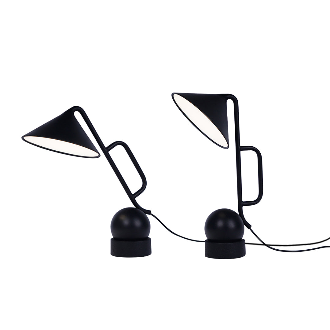 Dual black metal USB rechargeable table lamps creating balanced workspace illumination