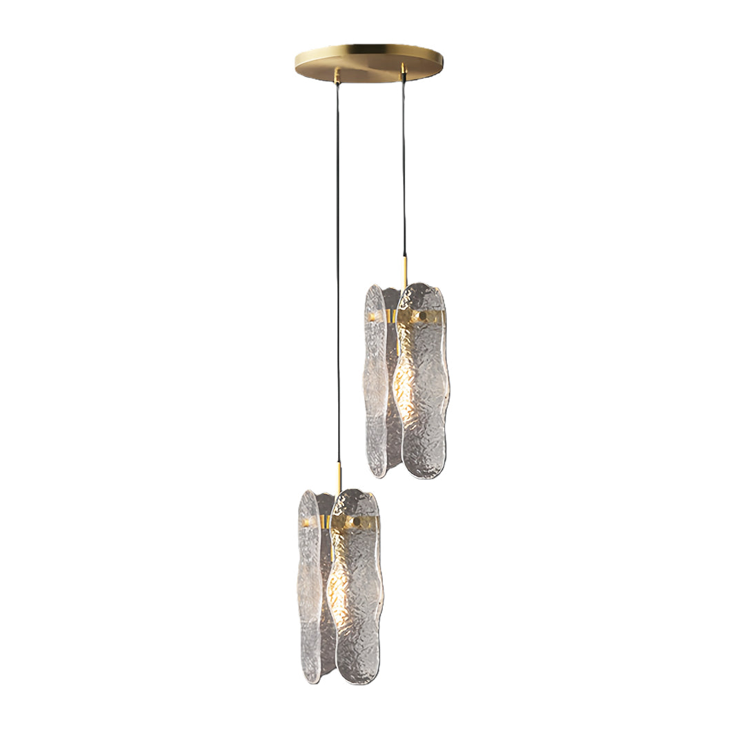 Dual brass glass pendant light fixture with two textured glass cylinders suspended at different heights.