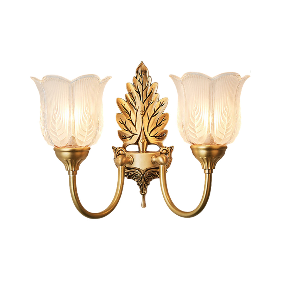 Traditional brass wall light with dual glass shades and decorative brass leaf accents