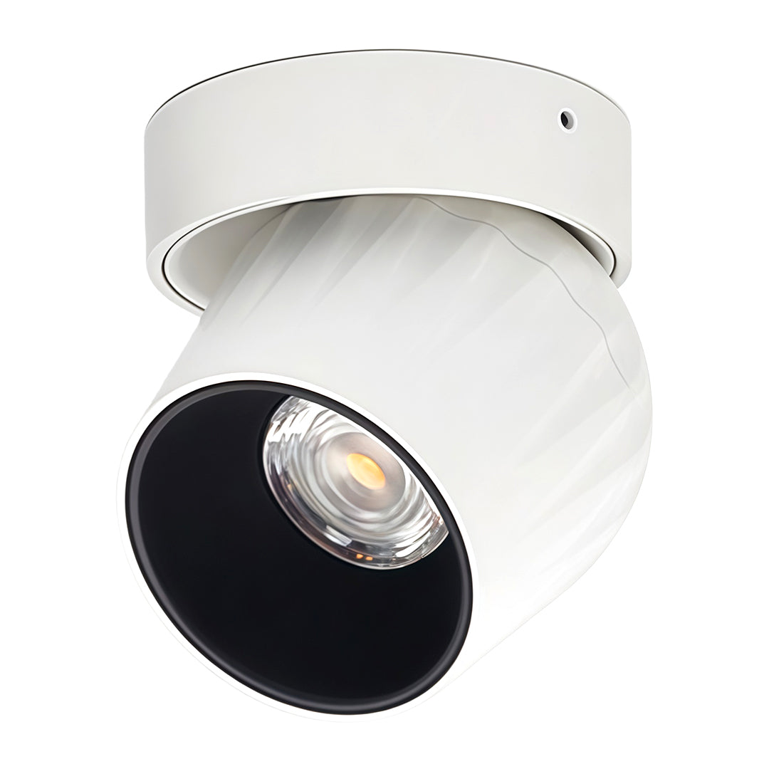 Dual-tone rotating spotlight with white housing and black aperture for contemporary ceiling installations