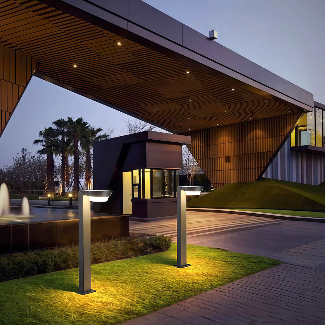 Modern LED path light with durable black metal base, perfect for illuminating walkways and garden features.