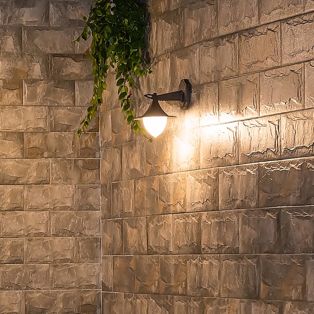 Sophisticated bronze outdoor light with triangular shade and premium architectural finish