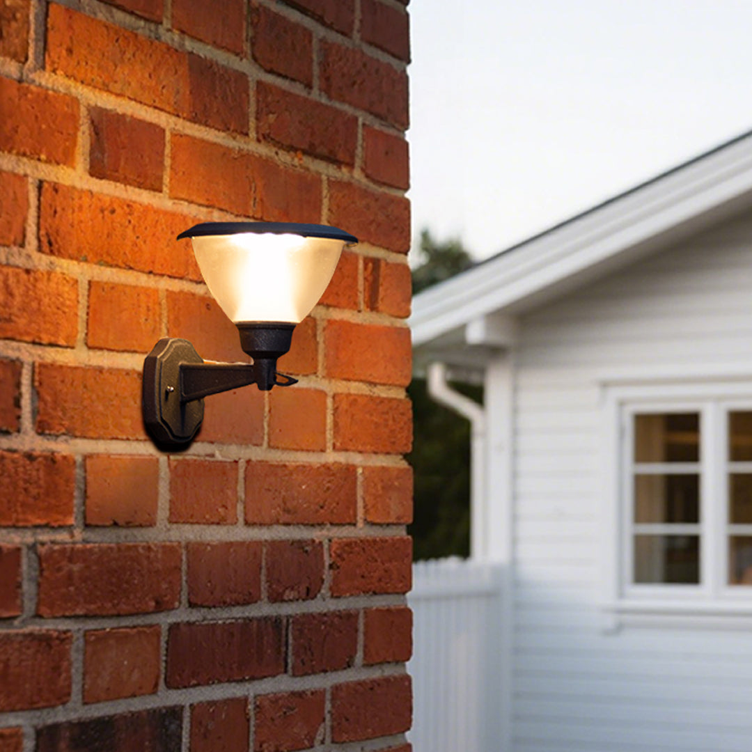 Warm LED wall light illuminating textured brick surface creating dramatic architectural lighting effects