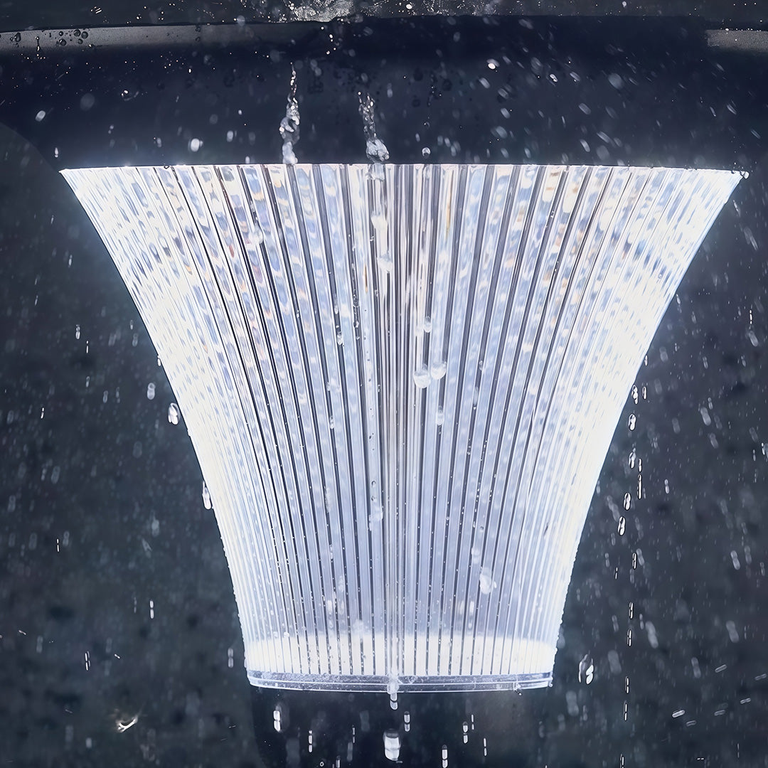 Bright, energy-efficient commercial streetlight illuminating a commercial plaza at night.
