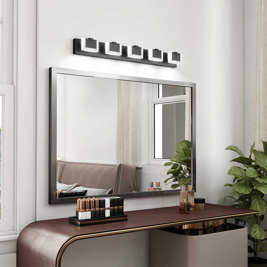 Elegant bathroom LED vanity lights featuring glass shade chandelier design in sophisticated neutral-toned bathroom with wood bench.