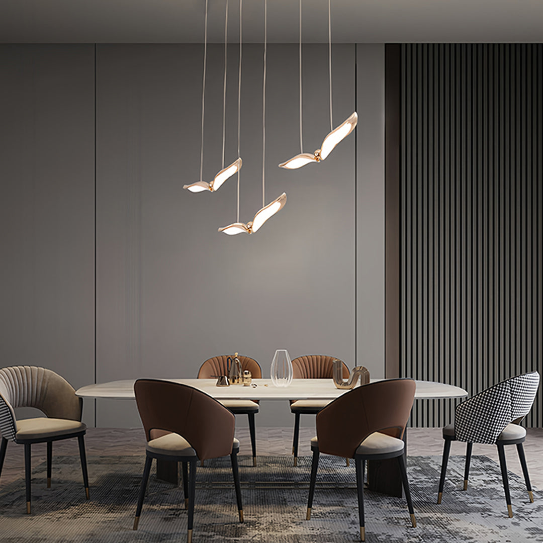 Elegant bird pendant light providing ambient lighting in luxury dining space