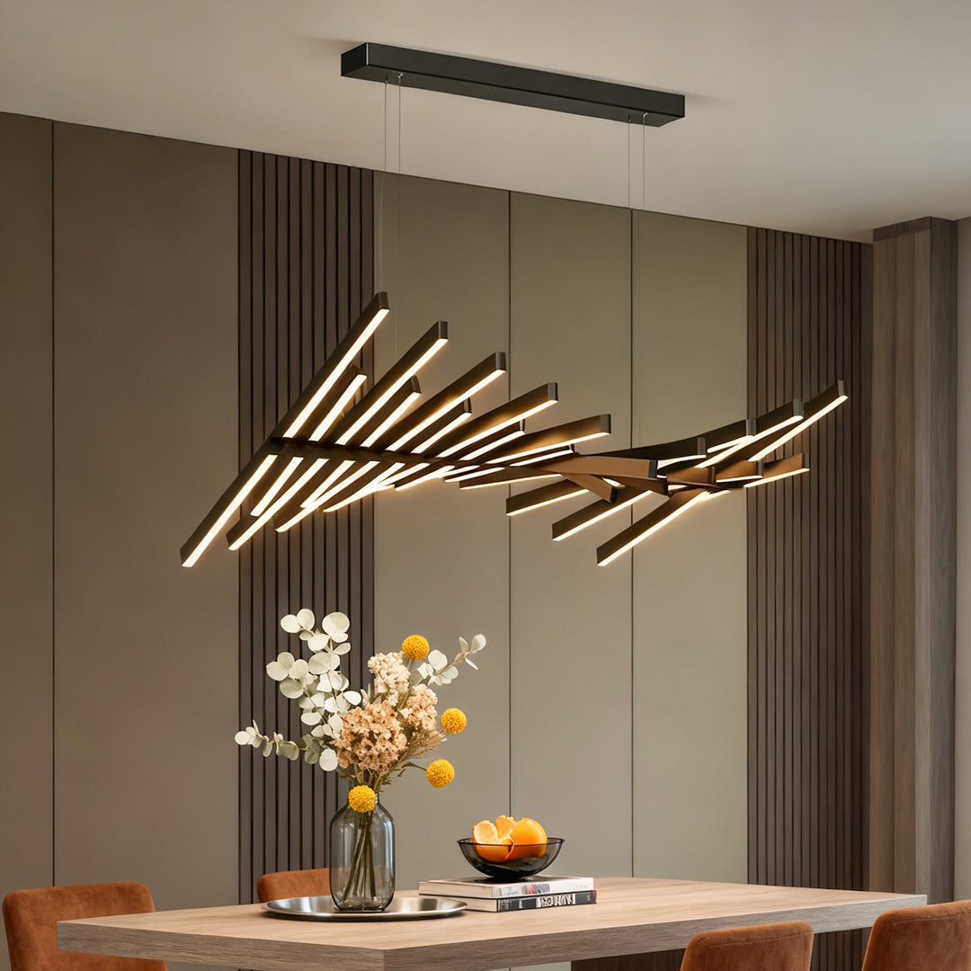 Elegant black art pendants light hanging above a dining table, adding a contemporary touch to the space.