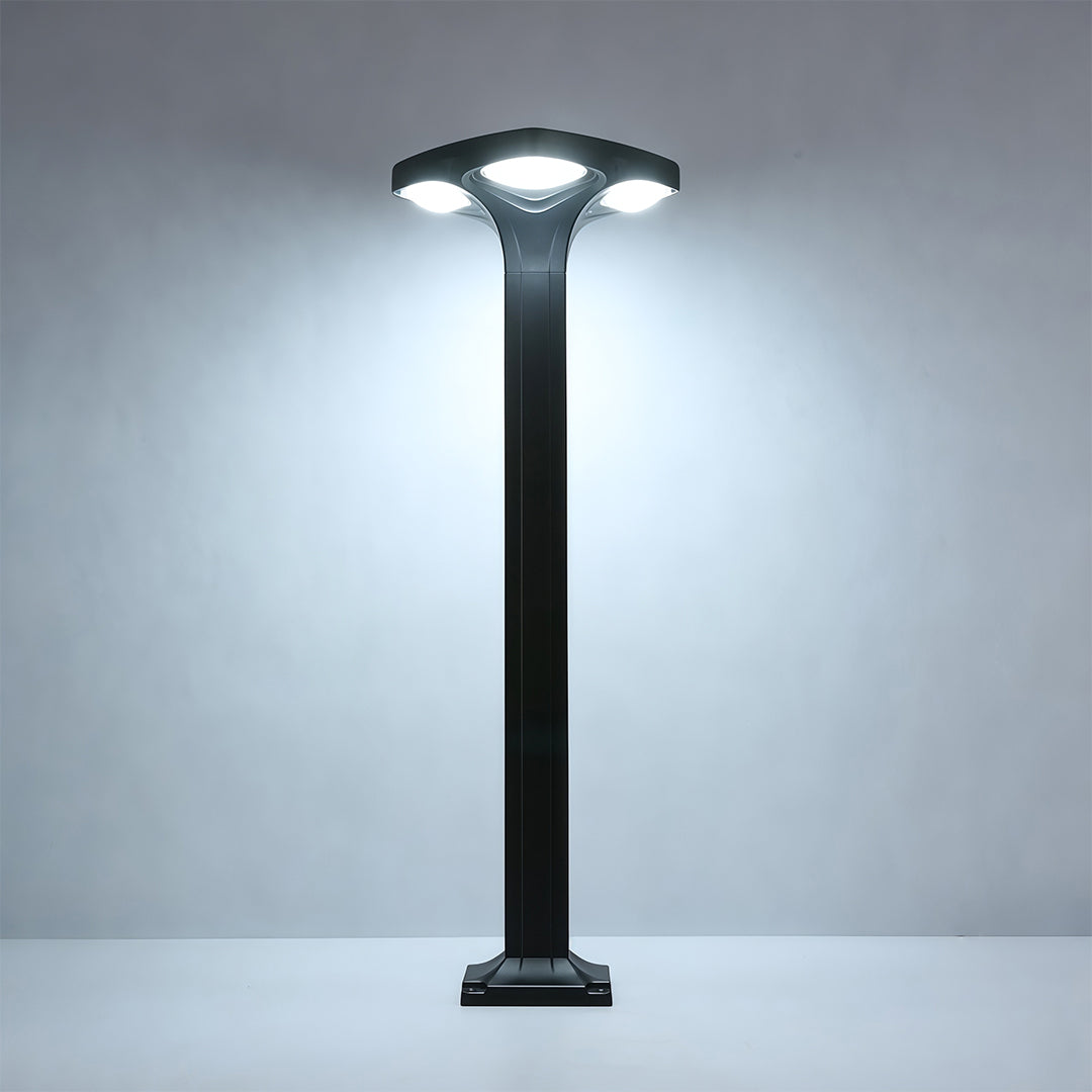 Elegant black wall light designed for outdoor use, softly illuminating the entrance to the house.