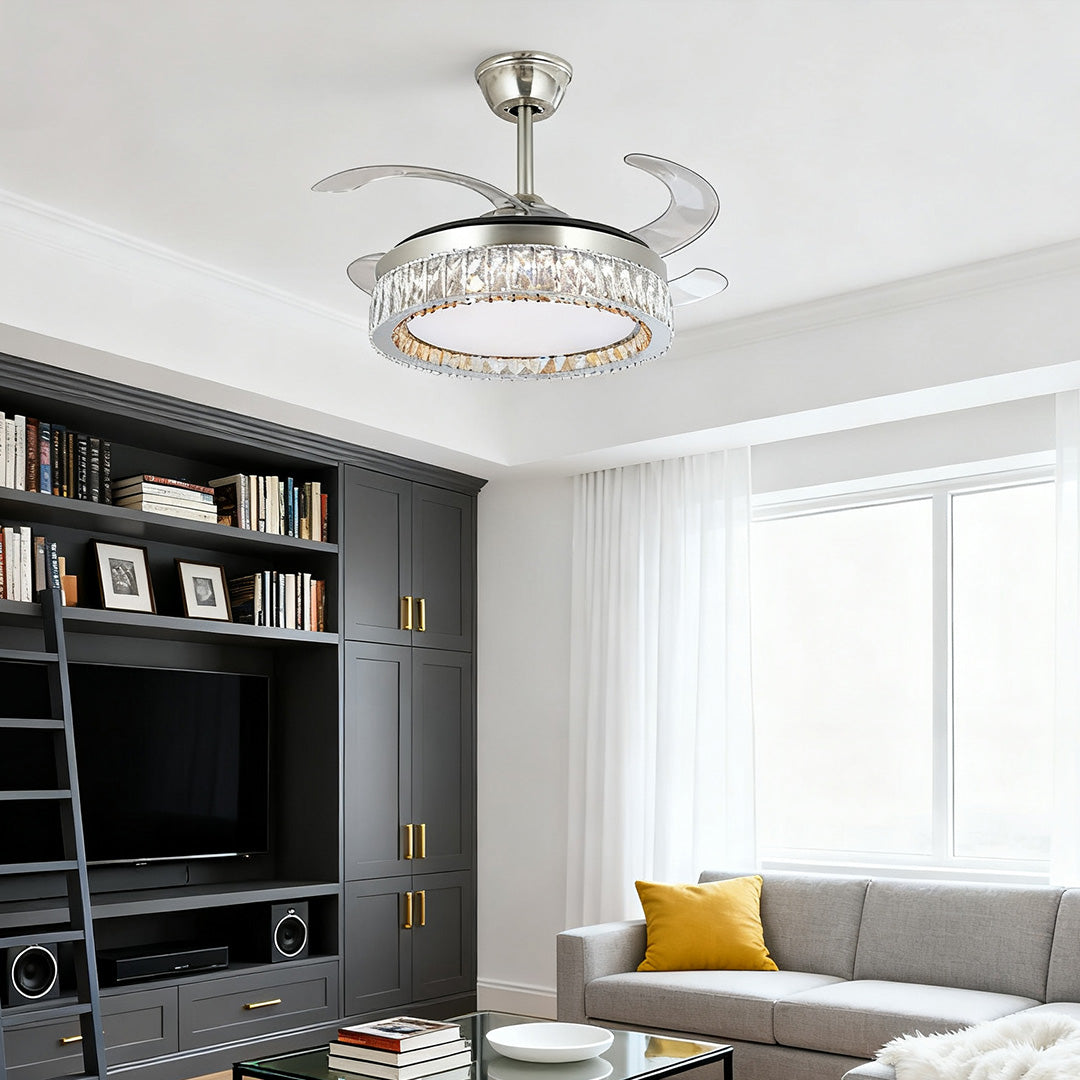 Elegant brushed nickel crystal ceiling fan with light over a modern media cabinet 