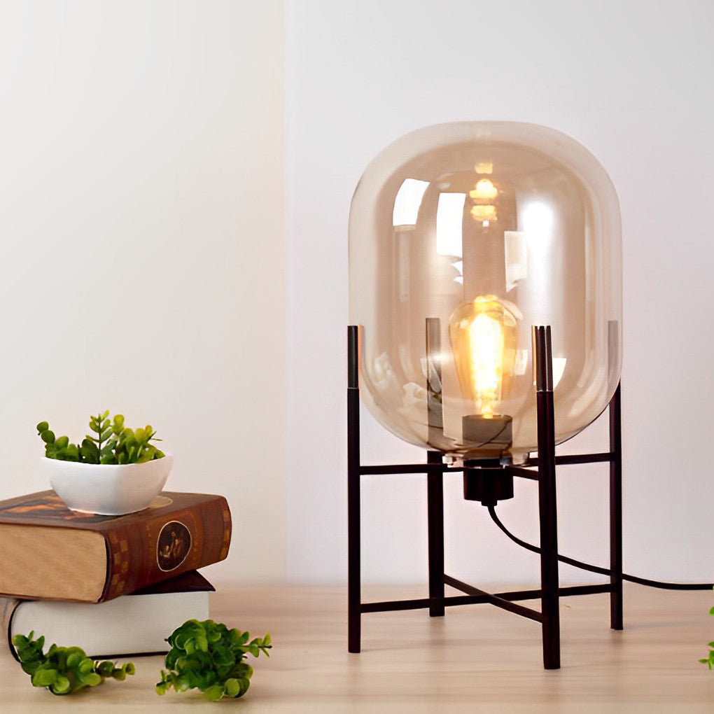 Elegant bubble glass floor lamp providing warm light in a stylish living room with plants.