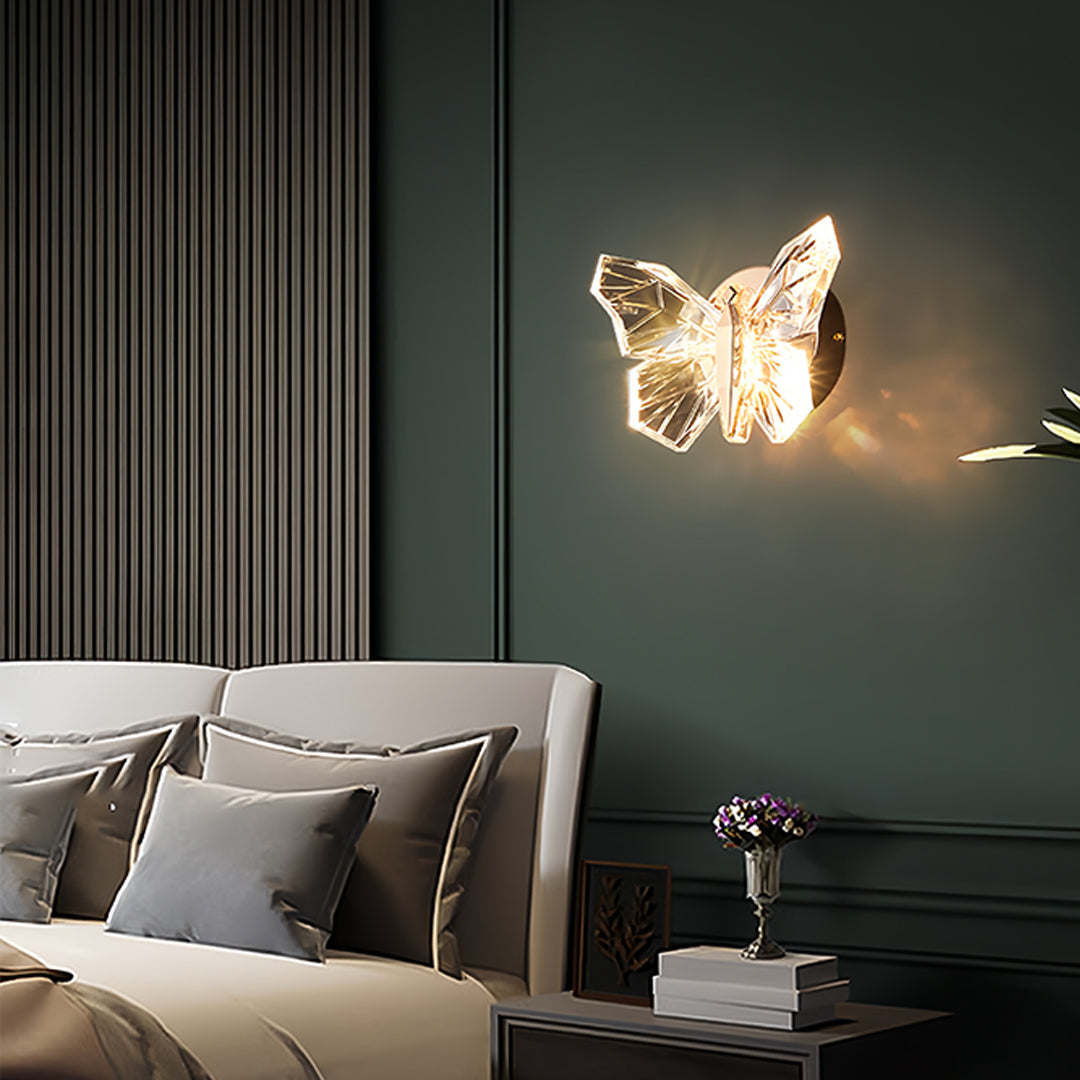 Elegant butterfly wall light providing soft illumination in sophisticated dark-walled interior space