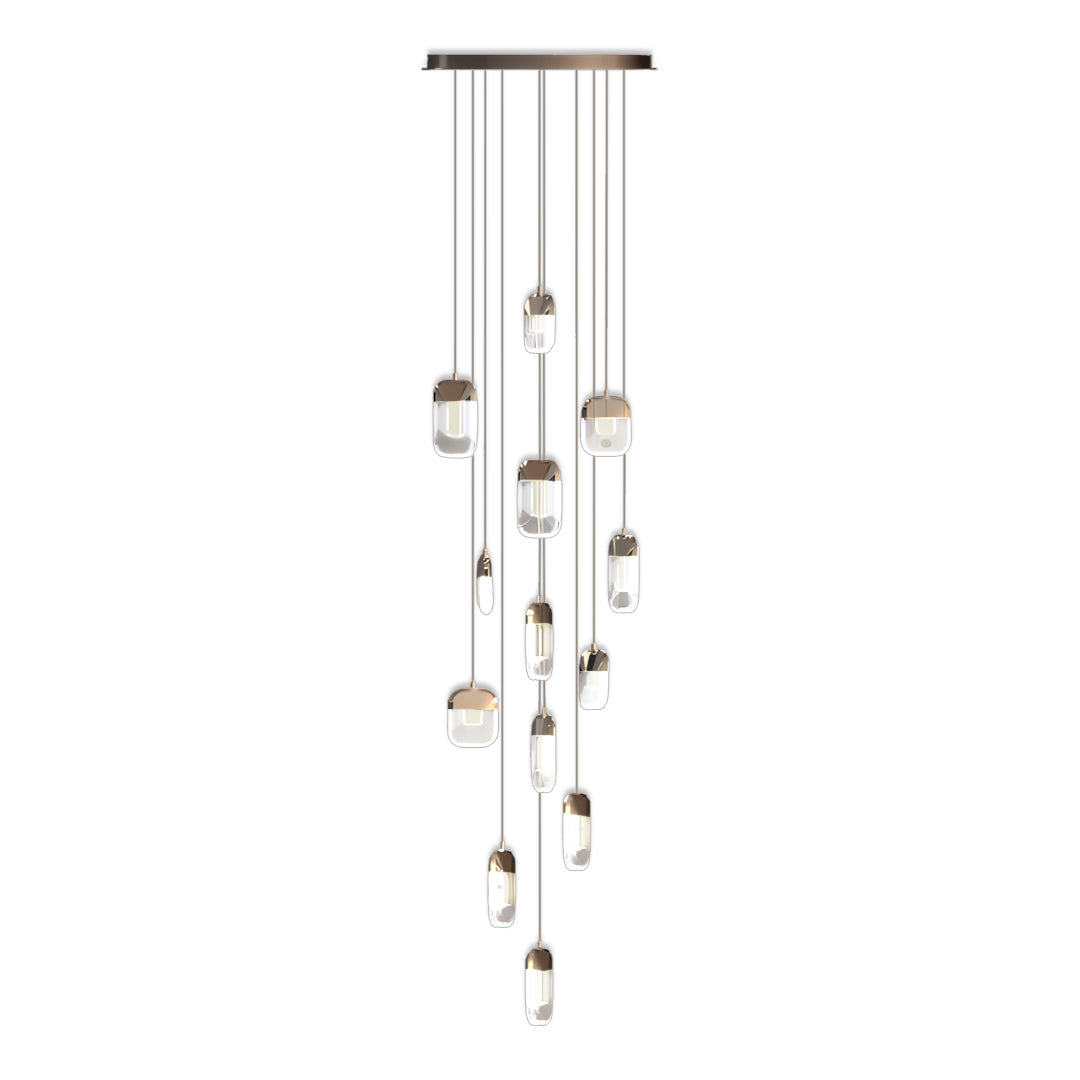 Elegant chandelier for staircase featuring cascading arrangement of mixed-size globe pendants in smoke and clear glass