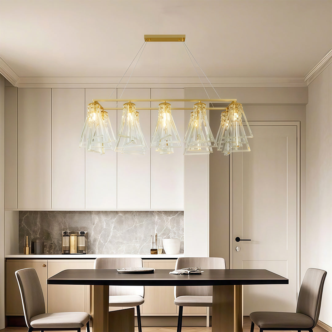 Elegant contemporary crystal chandelier featuring glass shade chandelier design illuminating modern kitchen with neutral color palette.