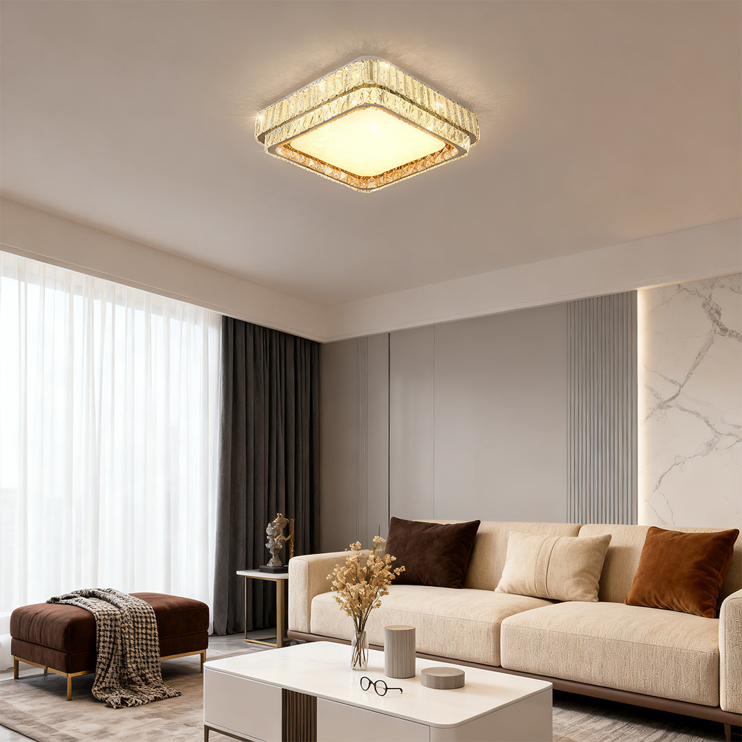 Elegant contemporary flush mount lighting with glass shade chandelier styling illuminating sophisticated neutral-toned living room.