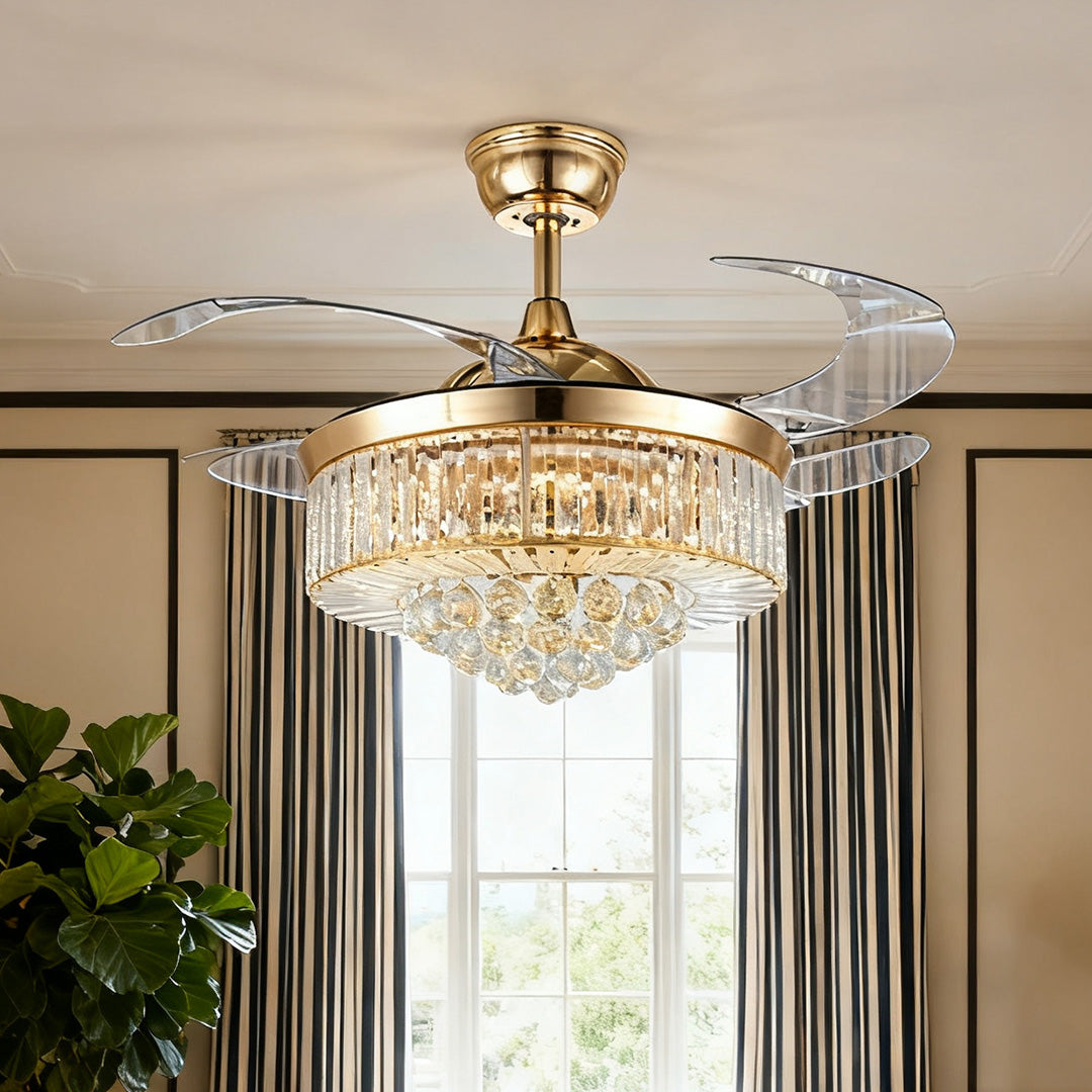 Elegant crystal ceiling fans with lights providing illumination over indoor plants and furniture 