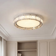 Elegant crystal flush mount ceiling lights with a silver frame and a frosted glowing center.