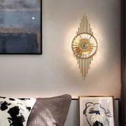 Elegant crystal light wall featuring glass shade chandelier design providing decorative accent lighting above bedroom headboard.