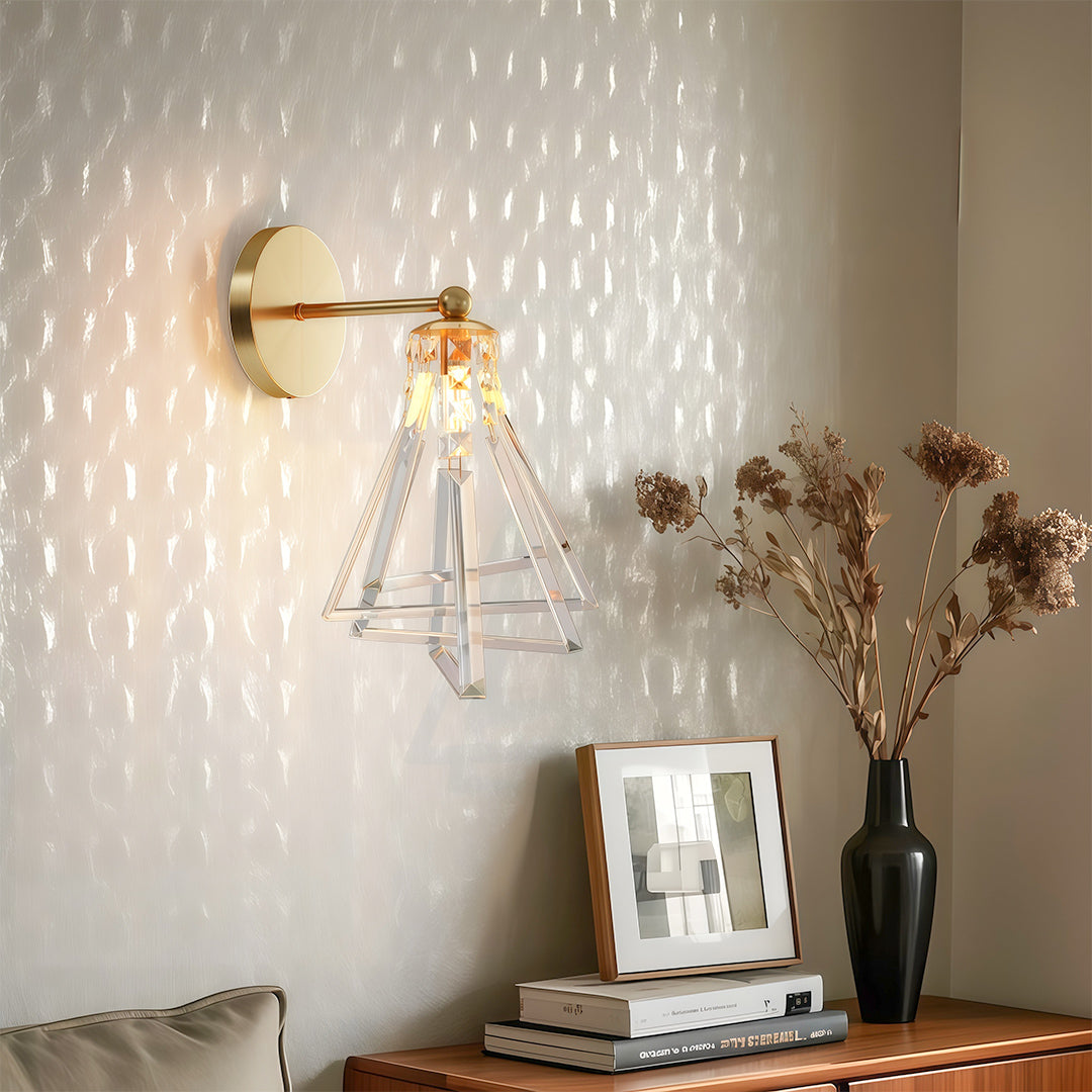 Elegant crystal wall lights with glass shade chandelier aesthetic illuminating neutral workspace with warm ambient glow and dried flowers.
