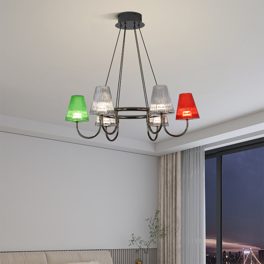 Elegant dining room lighting featuring suspended chandelier with mixed colored glass elements