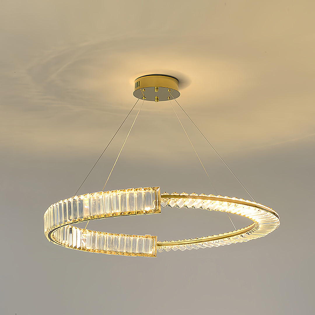 Elegant gold crystal chandelier with double-ring configuration providing ambient lighting