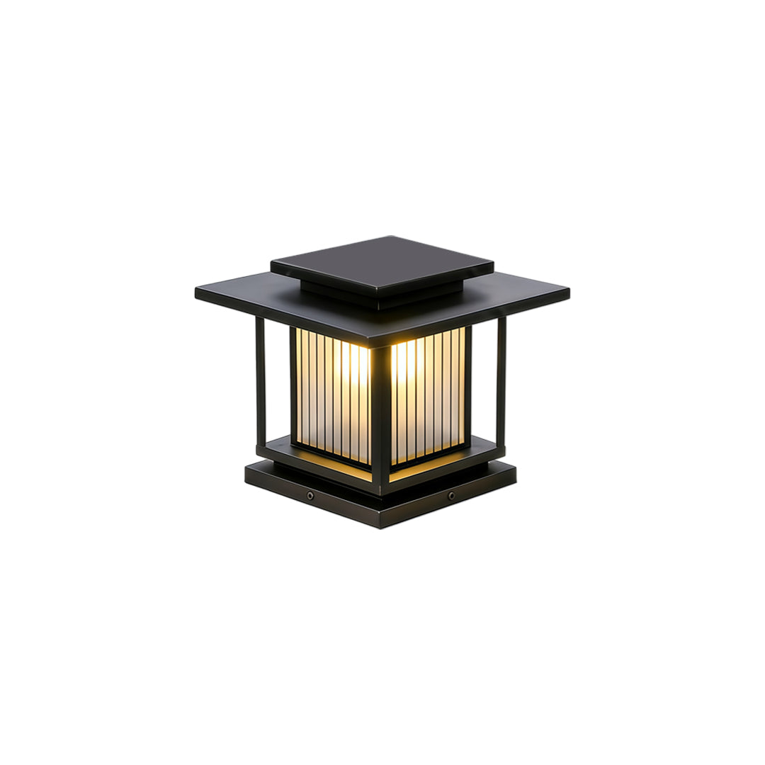 Elegant driveway pillar solar lights featuring vertical slat detailing and warm ambient illumination.