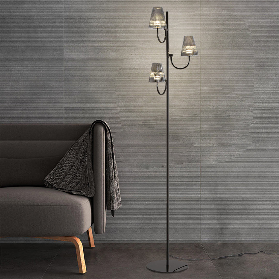 Elegant floor lamp with textured glass shades creating ambient lighting in modern living space