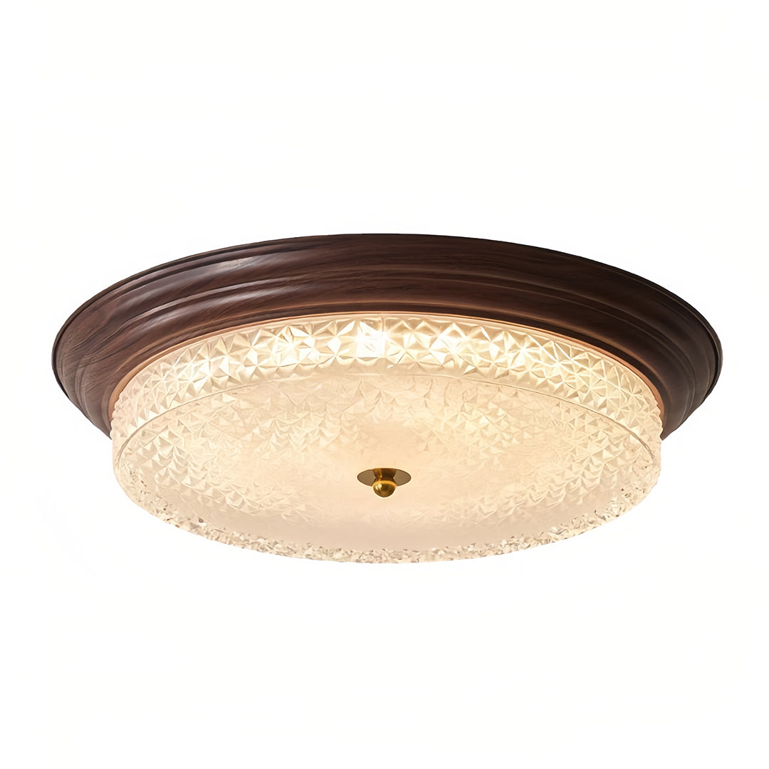Elegant flush mount dome light with bronze frame and textured frosted glass shade