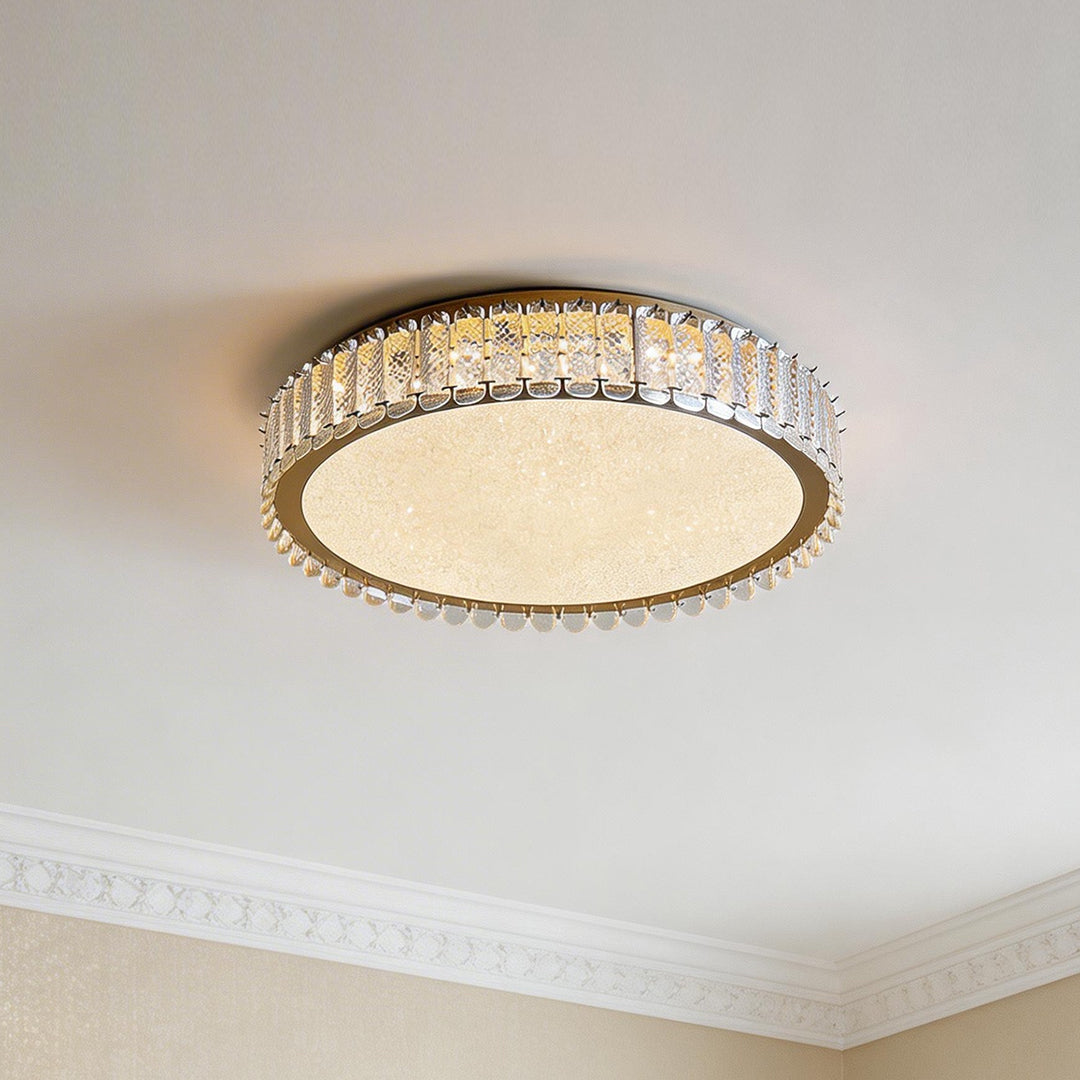 Elegant flush mount modern lighting with a clear crystal ring and warm glowing textured center.