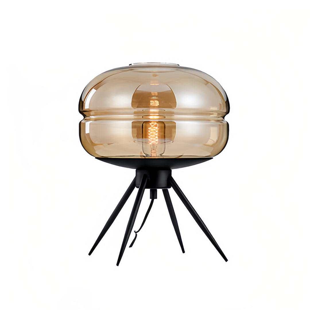 Elegant glass small table lamp with amber-tinted shade and minimalist black legs for warm illumination