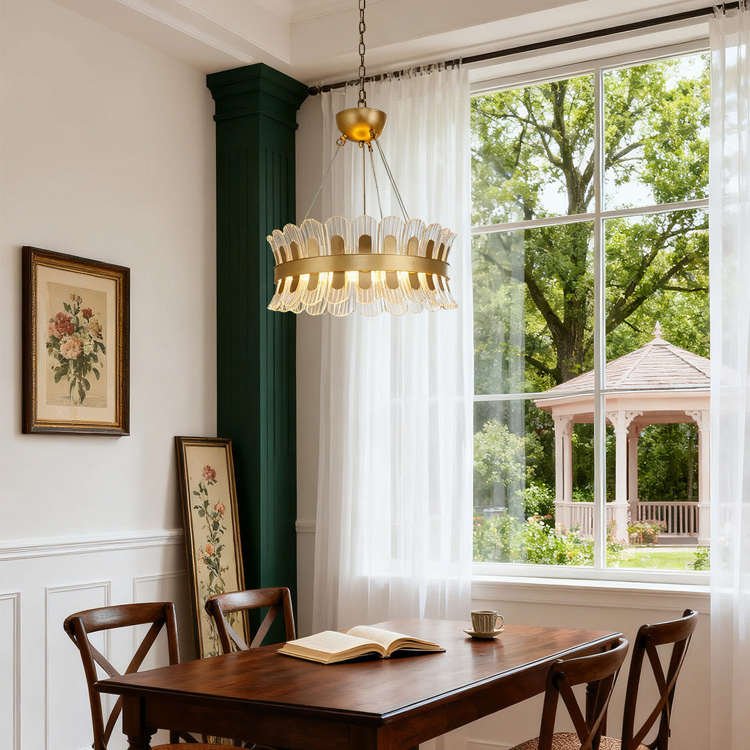 Luxurious gold candle-style chandelier in a traditional dining room with wooden furniture