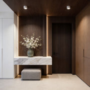 Elegant hallway with ceiling spotlights providing ambient lighting.