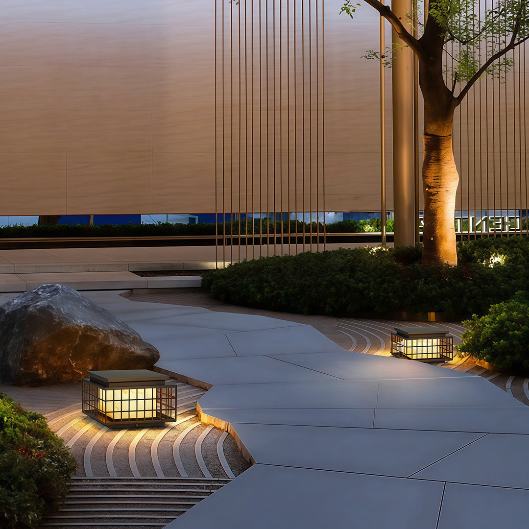 Modern gate pillar lights with a black grid design, providing elegant illumination for outdoor spaces.