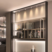 Elegant indoor spotlights highlighting luxury display cabinet with glass shade chandelier influenced lighting design.