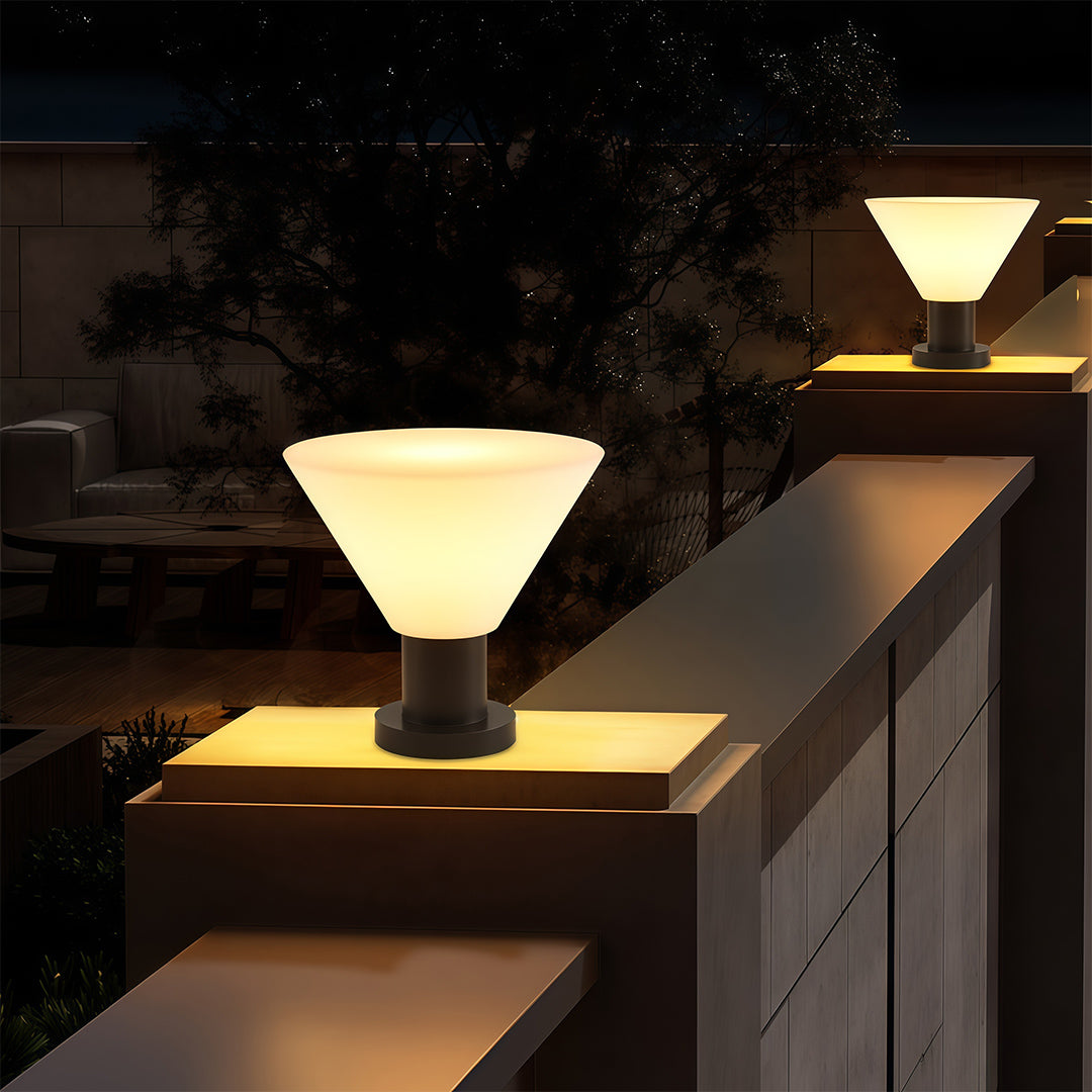 Elegant landscape pillar lighting featuring glass shade chandelier design illuminating modern outdoor wall with warm ambient glow.