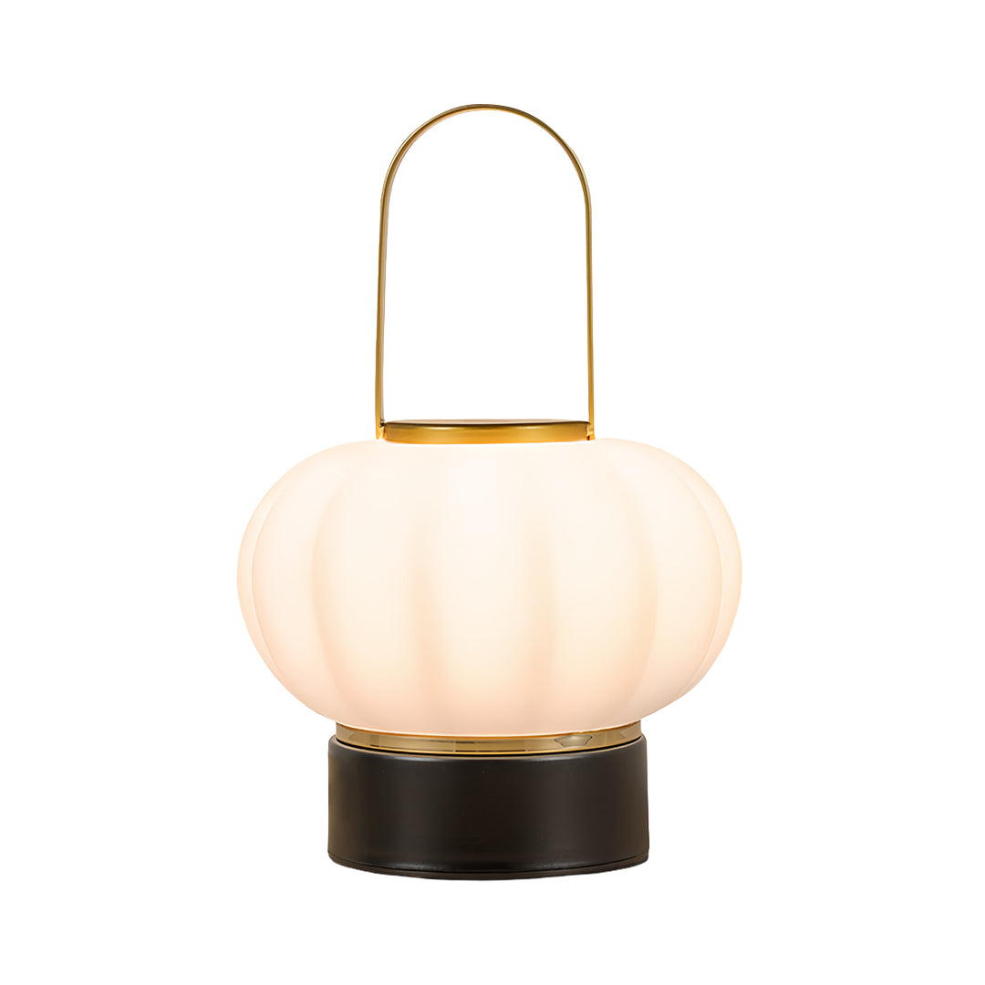 Elegant lantern table lamp featuring fluted glass globe with gold accent and black base