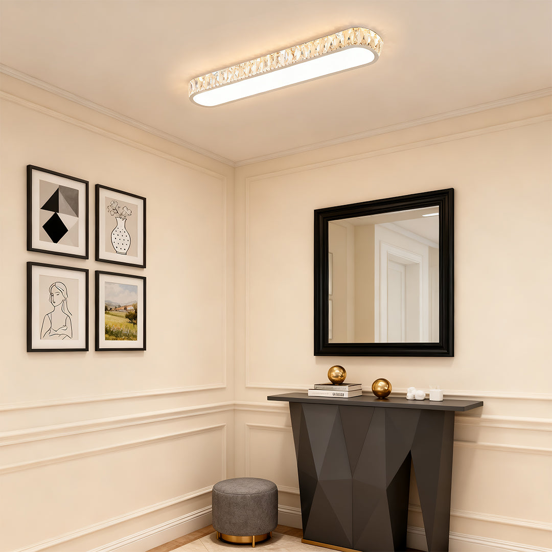 Elegant LED flush mount light fixture featuring glass shade chandelier design in sophisticated entryway with gallery wall.