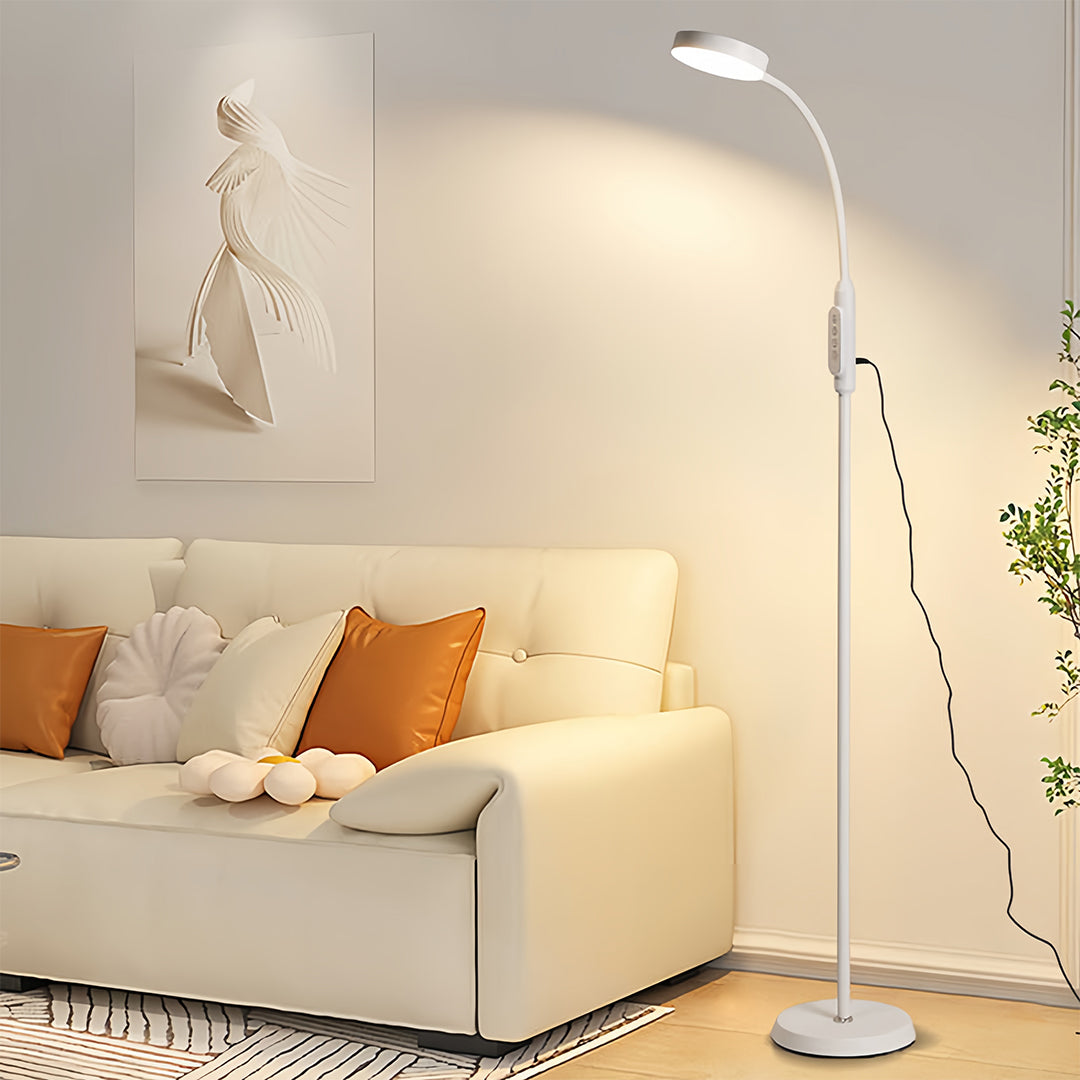 Elegant led reading floor lamp creating cozy reading nook with comfortable seating arrangement