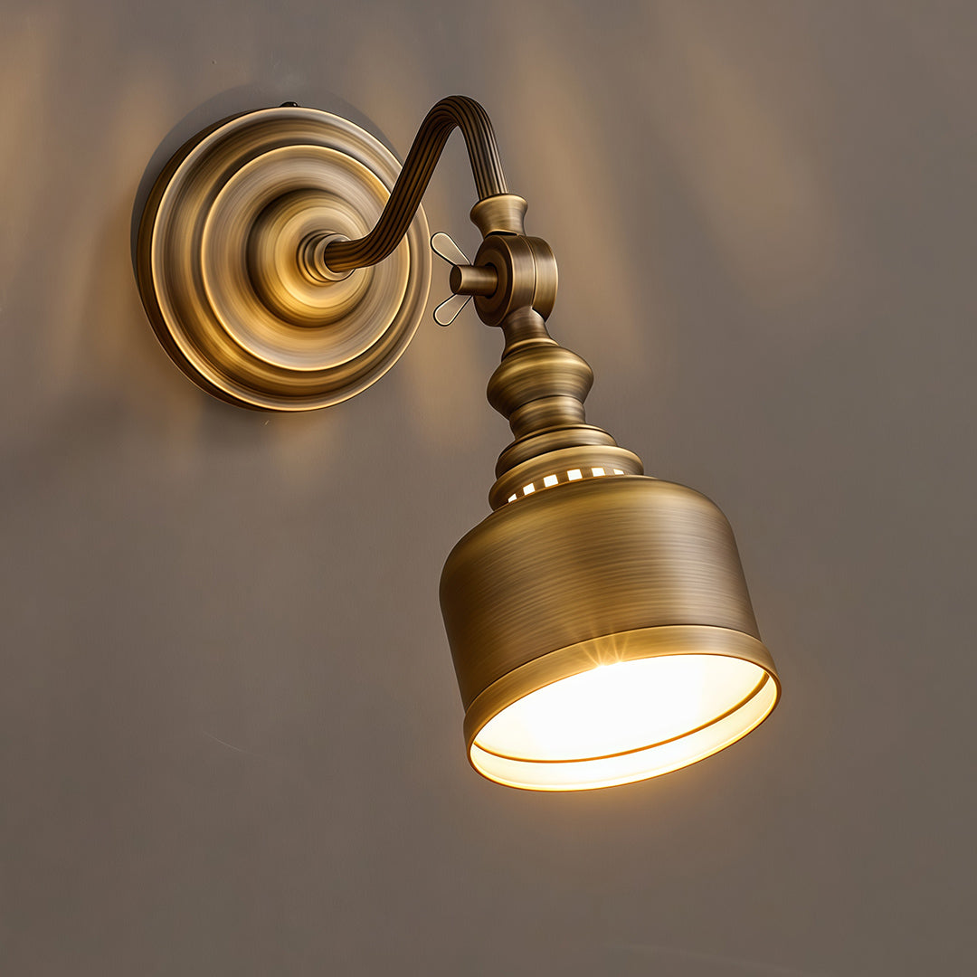 Elegant LED wall light lamp featuring glass shade chandelier styling creating warm downlighting with solid brass bell shade.
