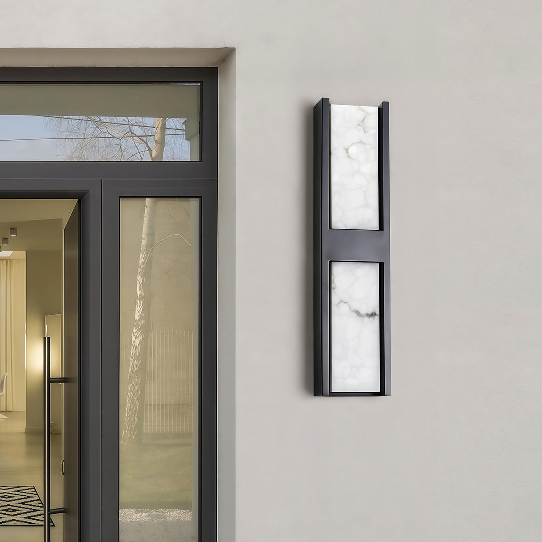 Elegant LED wall sconce light fixtures featuring glass shade chandelier styling illuminating modern exterior with blue accent door.